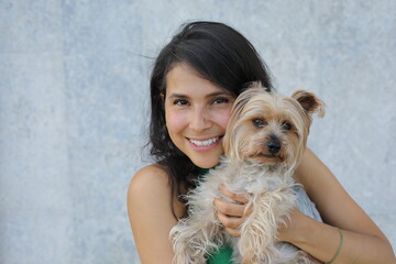 Pretty  woman with a very cute Yorkshire Terrier 