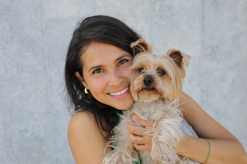 Pretty  woman with a very cute Yorkshire Terrier 