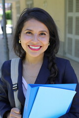 Elegant female student walking around in campus 