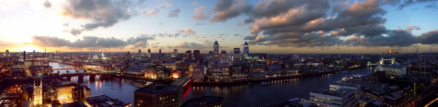 View of illuminated London skyline with River Thames and London Bridge, Southwark, England.
