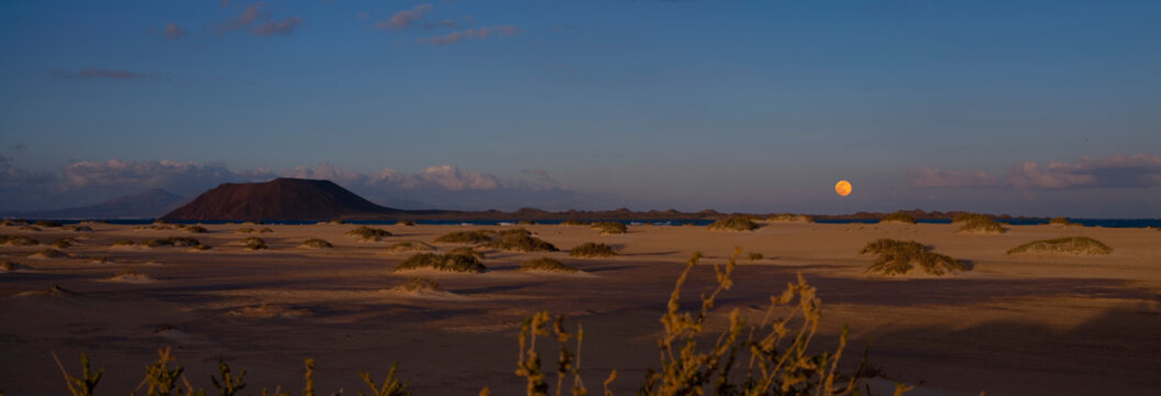 View of Fuerteventura moonrise in desert landscape, Pajara, Las Palmas, Spain.