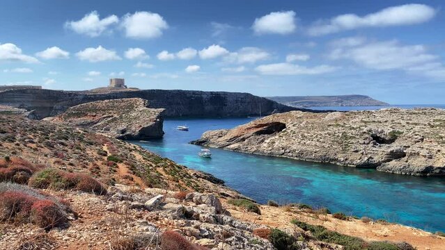 Comino Island Malta, Water scooters in between to rocks. Visiting caves in Comino . High quality 4k footage