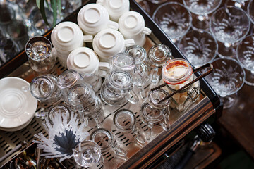 empty glasses and tea cups on the table. tableware for the holiday.
