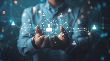 Businessman holding a virtual digital icon of a network connection in a futuristic technological world. A business team and employees collaborating