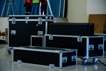 Flightcase open with led screens, in the background an operator at work.