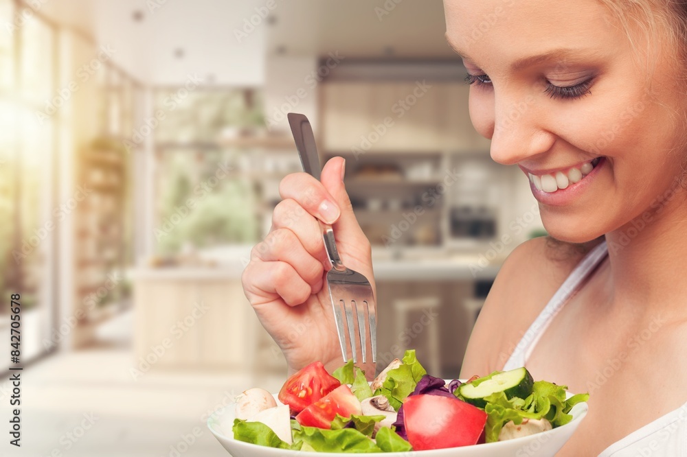 Wall mural Healthy Meal. Happy Woman Eating Fresh Salad