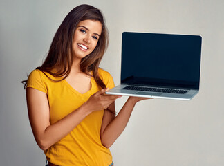 Laptop screen, portrait and woman for promotion, smile or advertising and isolated in white background. Computer, girl model and wireless connection for technology, presentation and mockup in studio