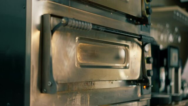 close up in professional kitchen there is a professional oven for quick cooking of pizza