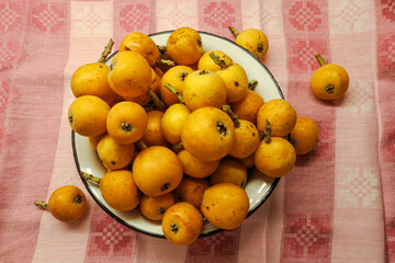 Bright medlar in a bowl