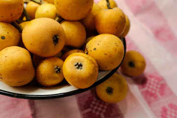 Bright medlar in a bowl