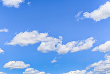 White clouds in a bright blue sky. The beauty of the nature	