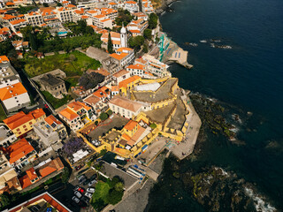 Funchal city of Madeira island Portugal with fortress on the coast of Atlantic Ocean. Aerial view