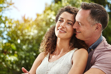 Smile, couple and hug for marriage bonding with commitment, relationship and connection in backyard. Excited, husband and wife with love embrace for anniversary, time and support together in nature