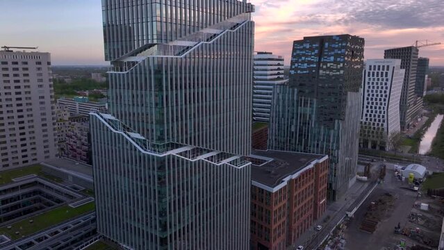 Aerial Drone Shot of Amsterdam Zuidas Financial District. Modern City with high Skyscrappers in Amsterdam, Netherlands.