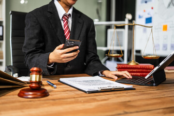 A young businesswoman is working at her desk, diligently preparing legal briefs and reviewing evidence for an upcoming trial, demonstrating her expertise as a lawyer in litigation and advocacy.