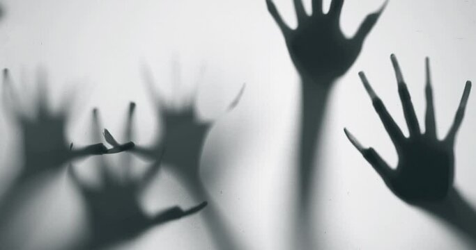 Shadow of a zombie hand on white background
