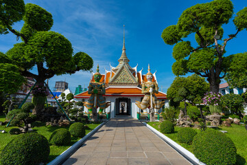 Fototapeta premium Pathway road to Ordination Hall with statues of Giants, demon guardians at Wat Arun