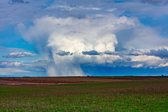 View of rain and cloud over field, Viransehir, Turkey.