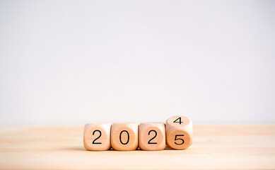 2025 happy new year with change to new era concept. Flipping the 2024 to 2025 year calendar numbers...