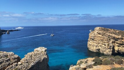 Boats sailing on the Mediterranean sea, between Comino and Malta islands. High quality photo