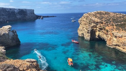 Luxury vacation. Visiting Comino caves in a boat. Malta, Mediterranean sea. High quality photo
