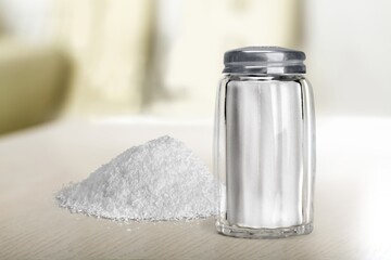 White Salt pile on a wooden table
