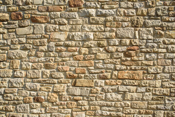 Pared exterior de ladrillos de piedra 