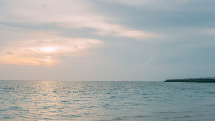 The view of the sunset and many beautiful clouds at Kelan Beach.