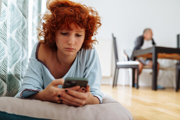 Fototapeta premium Portrait dreaming red-haired attractive teenager girl