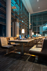 airport waiting room with digital tablets and lounge, advanced business class departures gate with computers
