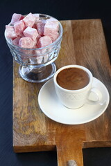 Turkish coffee and Turkish delight on a black background