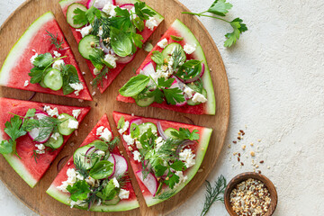 fresh watermelon pizza salad with feta cheese, cucumber and radish,