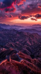 A dramatic and stunning sunset over the Great Wall of China, capturing the majesty and solitude of ancient borderlands