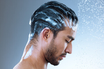 Studio, man and hair with shampoo, cleaning and routine of haircare, water drop and cosmetics for...