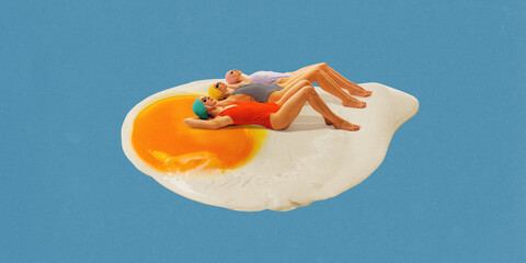 Three vintage-style women in swimsuits and bathing caps sunbathing on large fried egg against blue...