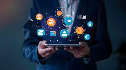 Digital marketing concept with a businessman holding a tablet and icons on a virtual screen for online advertising. social media market research or web design to grow business in the digital era 