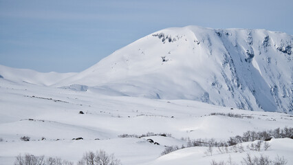 Norwegian high mountains in the snow. Mountains covered with snow. Scandinavia