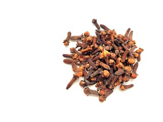 Aromatic pile of raw cloves on a white background.