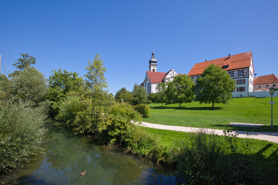 View from the city garden across the river Schmiech to the convict church.