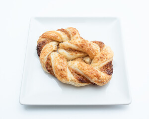 Pigtail bun on a white background
