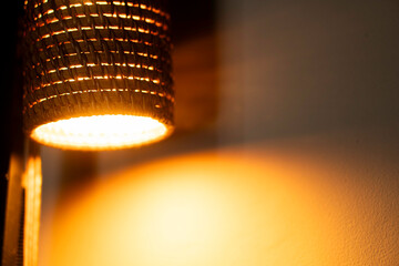 Woven lampshade with warm light bulb
