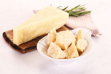 Chopped Italian hard parmesan cheese