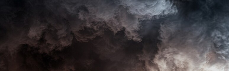 Fototapeta premium Dark and thick clouds of smoke after the explosion. Natural disaster, explosion, fire, earthquake. Natural disaster concept. Mist wallpaper. 