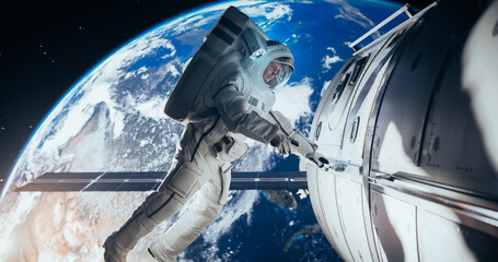 Portrait of a Young Male Astronaut in a Space Suit During a Spacewalk Outside a Spaceship,...