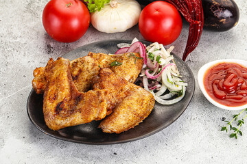Grilled chicken wings with sauce