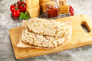 Breaded raw breaded meat schnitzel