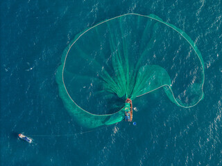 Aerial view of traditional wooden boat and fishermen are fishing anchovies in Yen Island, Phu Yen...