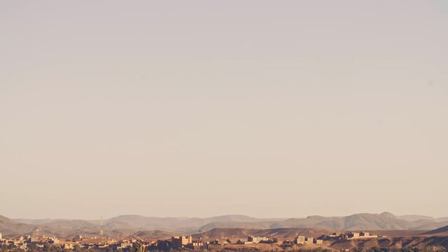 Ouarzazate, Morocco intermediate city village in Morocco. Sunset in the beautiful Moroccan landscape. Mud village in North Africa.