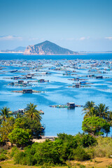 Aerial view of the lobster feeding farms, float fishing village in Vung Ro bay, Phu Yen, Vietnam. This is a very popular tourist destination.