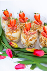 Homemade portioned dessert called Lazy Napoleon cake with puff pastry, custard and decorated with fresh strawberries
